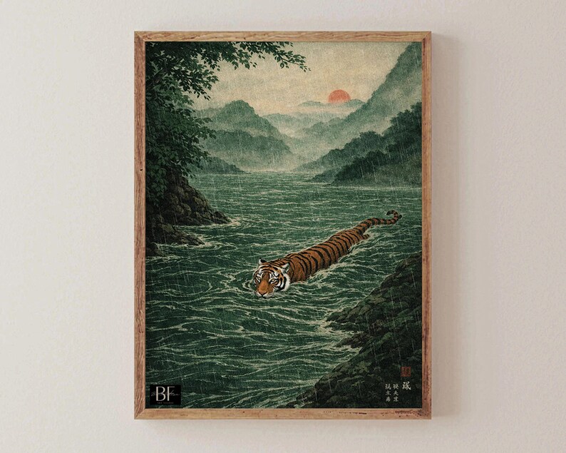 May include: A framed art print depicting a tiger swimming in a river, in the style of Japanese art. The tiger has orange and black stripes. The background shows mountains, a red sun, and a green river.