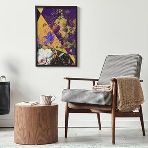 May include: A framed abstract floral print with a yellow, purple, and white color scheme. The print is hanging on a white wall above a black and white patterned armchair.