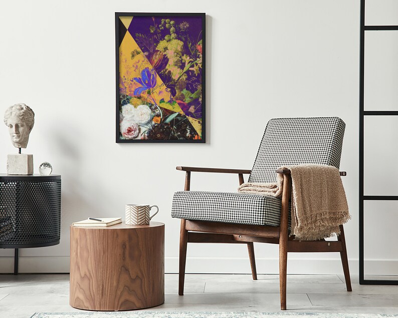May include: A framed abstract floral print with a yellow, purple, and white color scheme. The print is hanging on a white wall above a black and white patterned armchair.