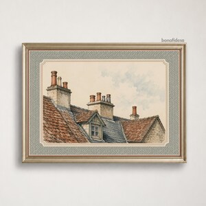 May include: A framed watercolor painting depicting a series of rustic rooftops with terracotta tiles, stone chimneys, and a small dormer window against a pale sky. The artwork is enclosed in a metallic frame with a gray herringbone patterned mat.