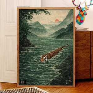 May include: A framed art print showing a tiger swimming in a river, with mountains and a setting sun in the background. The artwork is in a traditional Japanese style, with a wooden frame.
