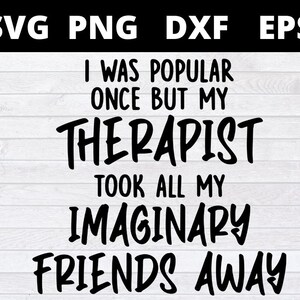 May include: Black and white text graphic design on a wood background. The text reads "I was popular once but my therapist took all my imaginary friends away."