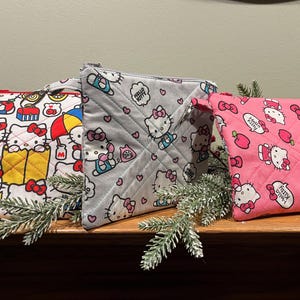 Hello Kitty quilted lined zip pouch, 7x6 kid’s organizer, 4 designs with lining, zipper pull, tab w/clasp to hook on backpack/back to school