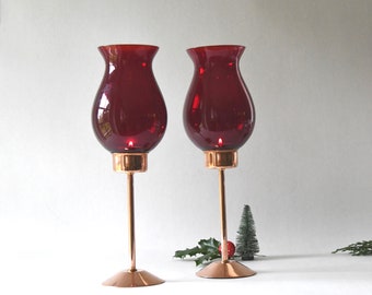 Copper candlesticks with Ruby red glass domes by Östlings Gnosjö Konstmide. 1960s Swedish Retro Lanterns