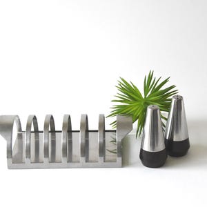 Stelton Cylinda Line. Toast Rack by Arne Jacobsen and a Rosewood Salt and Pepper set by Tias Eckhoff for Lundtofte