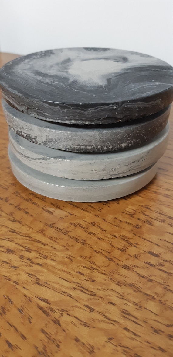 concrete coasters in a set of 4. Measure 4 inches wide