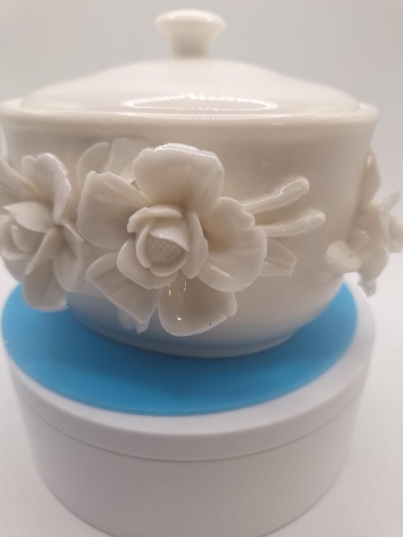 recycled ceramic white dish with sculpted flowers on side