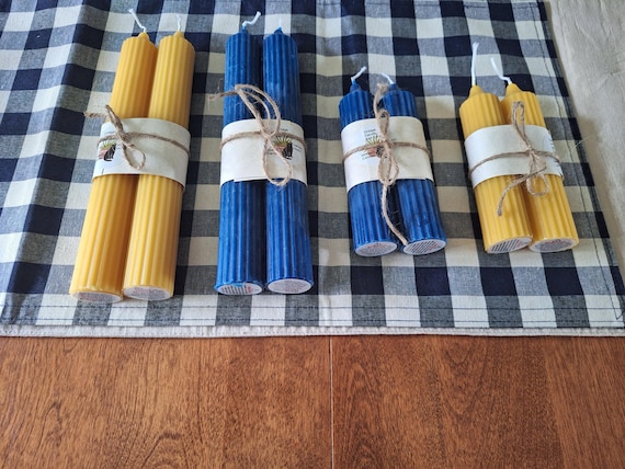 Slim pillar candles made from beeswax.