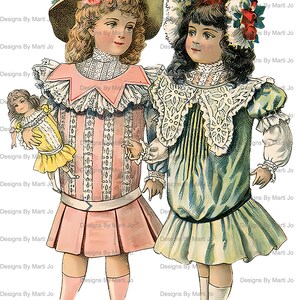 May include: Two girls wearing vintage dresses and hats. The girl on the left is holding a doll. Both girls are wearing white lace collars and have long hair. The girl on the left is wearing a pink dress with white stripes and the girl on the right is wearing a blue and green dress with white lace.
