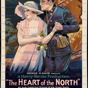 May include: A vintage movie poster advertising the film "The Heart of the North" starring Roy Stewart and Louise Lovely. The poster features a couple in a romantic embrace, with the man in a blue uniform and the woman in a pink dress. The poster is set against a backdrop of a forest.