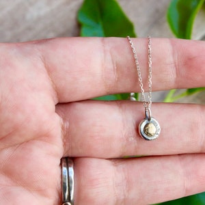 Sterling silver and 14k gold pebble pendant