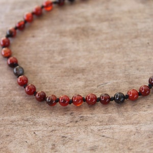 Carnelian, sard and agate hand beaded silk and sterling silver necklace