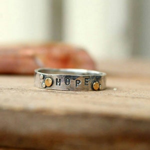 Hope sterling silver and 14k gold hammered band ring