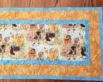Handmade quilted table runner.  Featuring Cats in the pattern.