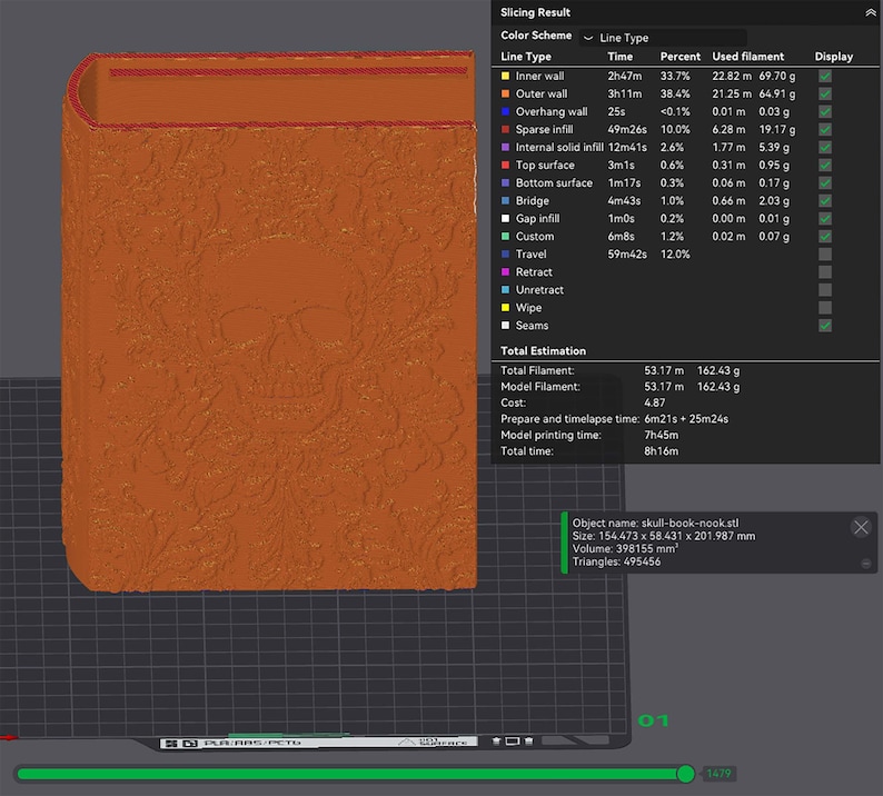 May include: A 3D-printed, orange-colored book-shaped object with a skull design on the cover. The object is displayed on a dark grid background, with a slicing result chart visible on the right side. The object's size is 6.08 x 2.30 x 7.95 inches.