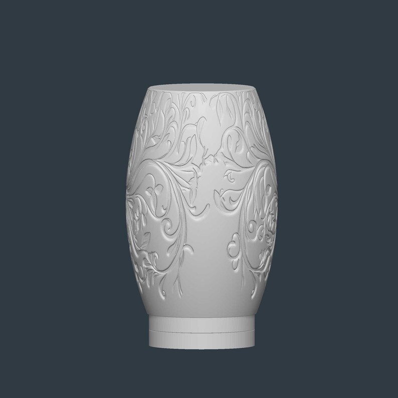 May include: A white, oval-shaped decorative vase with an intricate floral pattern carved into its surface. The vase has a wide base and a slightly narrower top, with a smooth, unadorned rim. The background is a solid, dark gray.