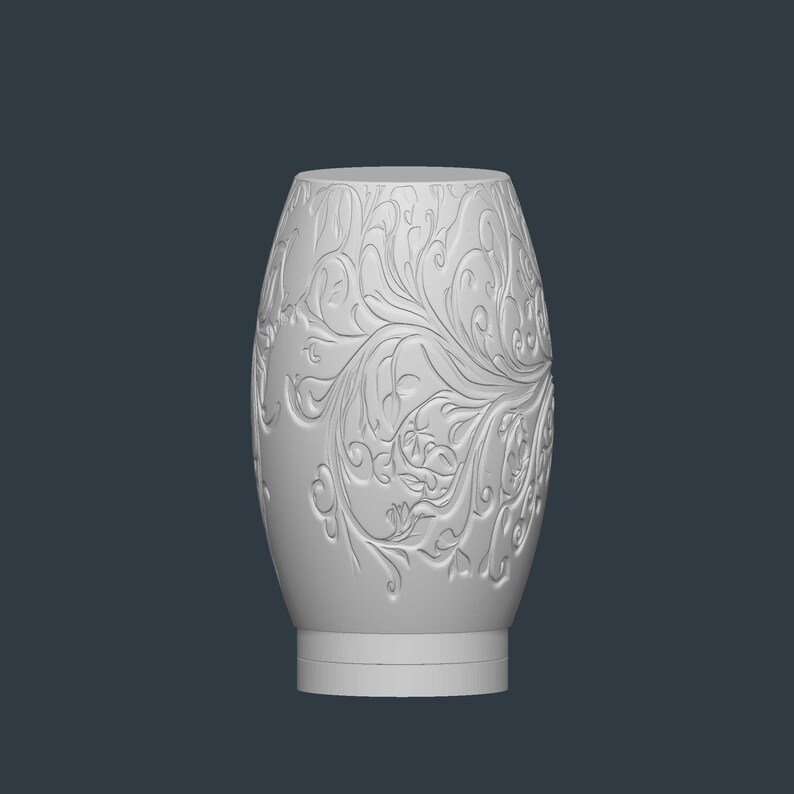 May include: A white, oval-shaped vase with an embossed floral design. The vase has a wide base and a slightly narrower top. The floral pattern covers the entire surface of the vase, creating a textured appearance.