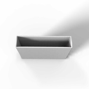 May include: A rectangular, light gray container with a slightly trapezoidal shape. The interior is a darker shade of gray, creating a contrast. The container is empty and sits against a white background.