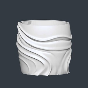 May include: A white, cylindrical decorative object with a draped fabric design. The fabric appears to be flowing and has a wavy texture. The object has a smooth, clean finish and is set against a dark background.