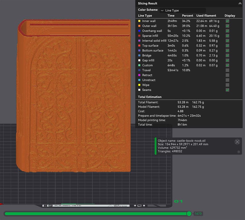 K&ouml;nnte beinhalten: Ein orangefarbenes, 3D-gedrucktes, buchf&ouml;rmiges Objekt mit aufwendigen gepr&auml;gten Details. Das Objekt hat einen gebogenen R&uuml;cken und scheint ein dekoratives Element oder ein Modell zu sein. Das Bild enth&auml;lt Druckdaten.