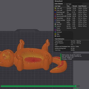 May include: A 3D-printed orange cat-shaped jewelry plate, lying on its back. The plate's design shows internal structures and measurements. The object's size is 200.278 x 97.96 x 52.8764 mm.