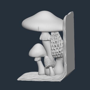 May include: A white mushroom bookend featuring various mushroom types, including a large cap mushroom, a morel, and smaller mushrooms. The bookend has a textured base and a vertical support, all in a neutral color.