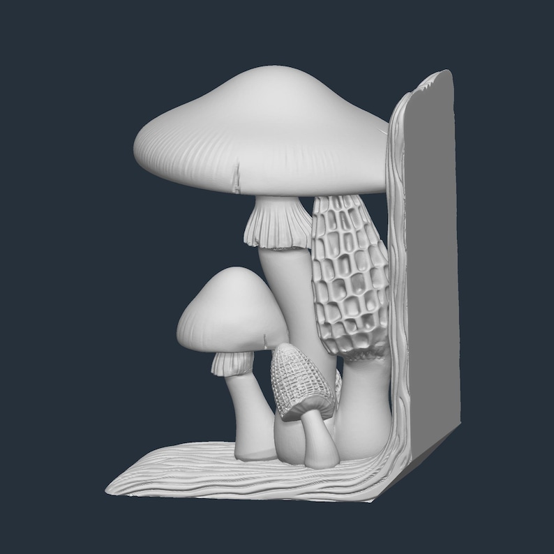 May include: A white mushroom bookend featuring various mushroom types, including a large cap mushroom, a morel, and smaller mushrooms. The bookend has a textured base and a vertical support, all in a neutral color.