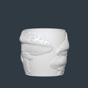May include: A white cylindrical planter with a detailed relief of mushrooms. The mushrooms have textured caps with spots and detailed gills. The planter is suitable for indoor or outdoor use.