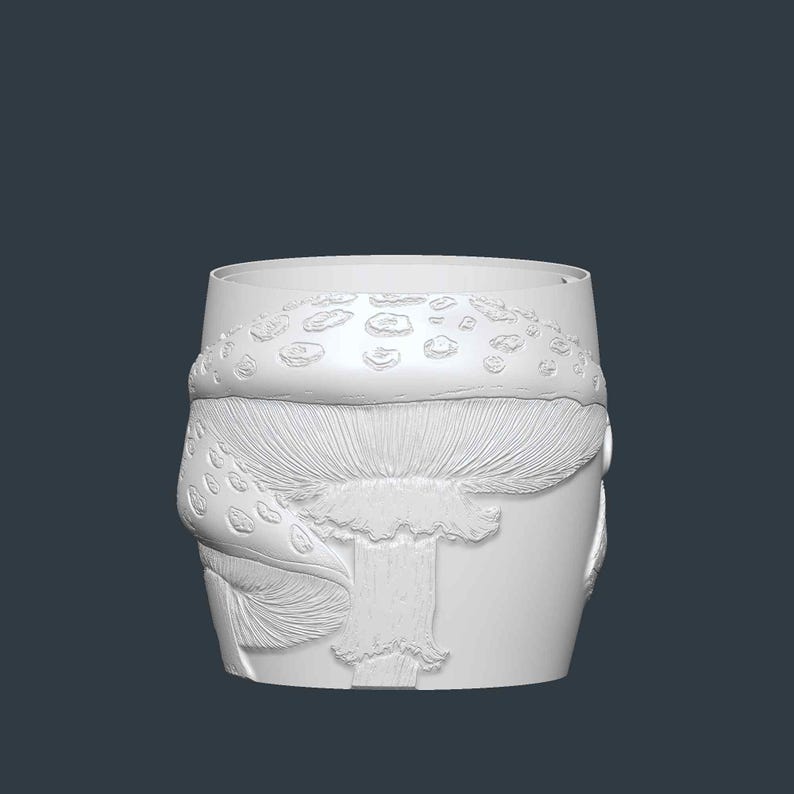 May include: A white, cylindrical container with a detailed relief of a mushroom design. The mushroom features a textured cap with small, raised spots and a detailed stem. The container is likely for home decor.