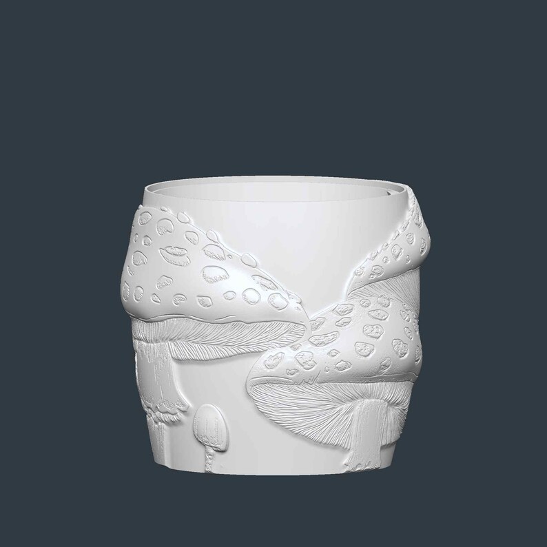 May include: A white cylindrical planter with a detailed relief of mushrooms. The design features large mushroom caps with textured spots and gills, and smaller mushrooms at the base. The planter is suitable for indoor or outdoor use.