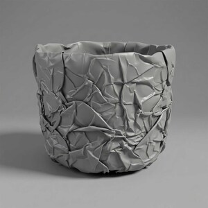 May include: A cylindrical vessel with a matte grey finish, featuring a highly textured surface that mimics the appearance of crumpled paper. The object has an open top and a rounded base, with deep folds and creases throughout its exterior.