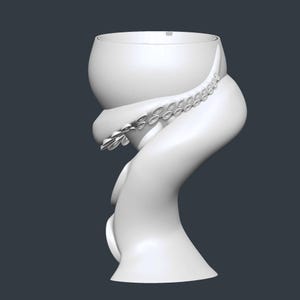 May include: A white, stylized ceramic vase with an octopus tentacle design. The vase has a bulbous top and a curved, flowing base. The tentacle wraps around the vase, featuring detailed suckers. The overall design is smooth and modern.