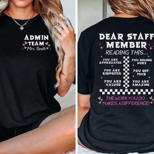 May include: Black t-shirt with white text that reads "Admin Team Mrs. Smith" on the front and "Dear Staff Member Reading This... You Are Appreciated + You Are Respected + You Are Valued You Belong Here + You Got This + You Are Amazing The Work You Do Makes A Difference!" on the back.