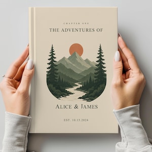 May include: A book cover with a landscape illustration featuring mountains, a river, and trees under a setting sun. The title reads "The Adventures of" with the names "Alice & James" and the date "EST. 10.15.2024". The cover has a cream-colored background.