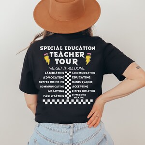 May include: Black t-shirt with the text "Special Education Teacher Tour" and a lightning bolt graphic. The text "We Get It All Done" is below the graphic. A list of words related to teaching is below the text, including "Laminating", "Advocating", "Coffee Drinking", "Communicating", "Adapting", "Facilitating", "Accommodating", "Educating", "Encouraging", "Accepting", "Differentiating", and "Difference Making".