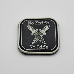May include: Black and white patch with two crossed knives and the text "No Knife No Life" in white.