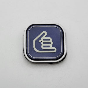 May include: A blue square patch with a white thumbs up icon. The icon is a hand with a thumb pointing up.
