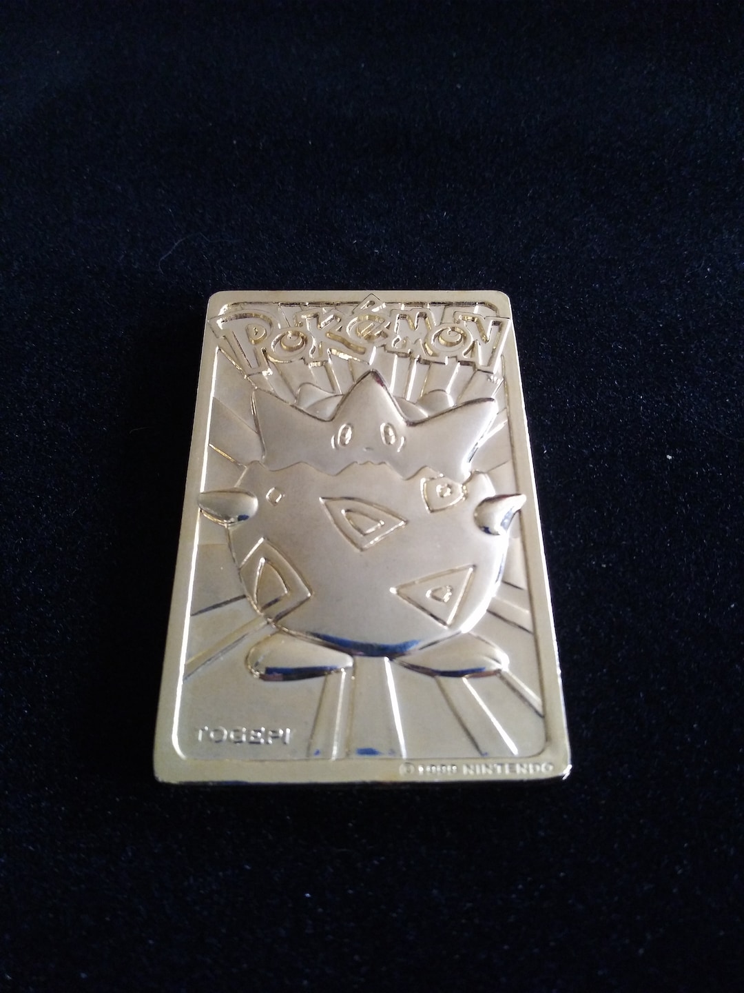 23 karat gold pokemon card togepi RarityCommon Hit Points50 HP Colorless Whiny Voice Choose a random card from your opponent’s hand Togepi 083/197 SV03 Obsidian Flames