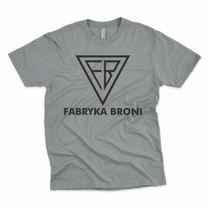 May include: A gray t-shirt with a black triangle logo that says "FB" inside the triangle. Below the logo is the text "FABRYKA BRONI".