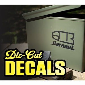 May include: A green metal ammo can with a black Barnaul logo and the text "Die-Cut Decals" in yellow letters on a black background.