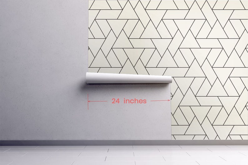 May include: A roll of white wallpaper with a black geometric pattern of overlapping triangles. The wallpaper is 24 inches wide.
