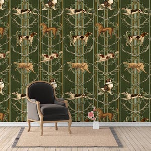 May include: A dark green wallpaper featuring a repeating pattern of hunting dogs, deer antlers, and vertical stripes. A dark gray upholstered armchair with light wooden legs sits in front of the wall, placed on a rectangular beige rug.