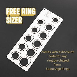 May include: White ring sizer with multiple ring size cutouts. The text "FREE RING SIZER" is in a yellow font. The text "comes with a discount code for any ring purchased from Space Age Rings" is also visible.