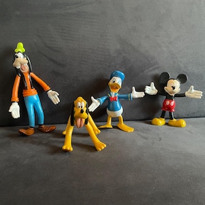 Set of 4 vintage Walt Disney figurines, Donald Duck, Mickey Mouse, Goofy and Pluto