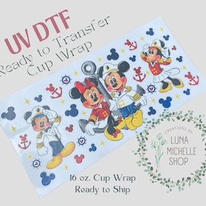 May include: A 16 ounce cup wrap featuring a nautical themed design with Mickey Mouse and Minnie Mouse dressed as sailors. The design includes anchors, stars, and red, white, and blue accents.