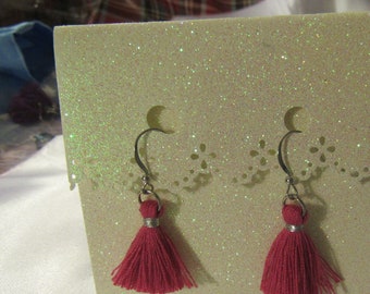Handmade tassel drop earrings on a fishhook, in coral, salmon, fuschia, or purple.