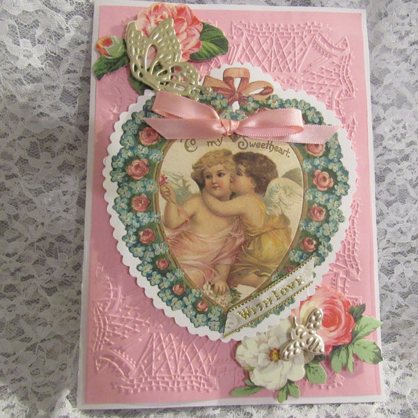 Cupid embossed Valentine card, pink, lace ruffle, heart, roses, die cuts, gold foil butterfly and bee, romantic verse.