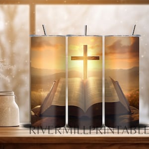 May include: A sublimation design featuring a wooden cross with a sunset background and an open bible. The design is perfect for a tumbler or other sublimation projects.