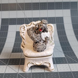 Vintage Japan Grey Spaghetti Poodle Dog in a Chair Figurine