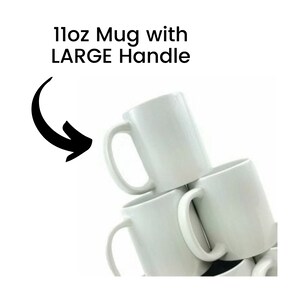 May include: A stack of white ceramic mugs with large handles. The mugs are 11oz and are perfect for coffee, tea, or hot chocolate.